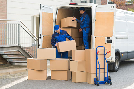 men loading boxes in a moving truck